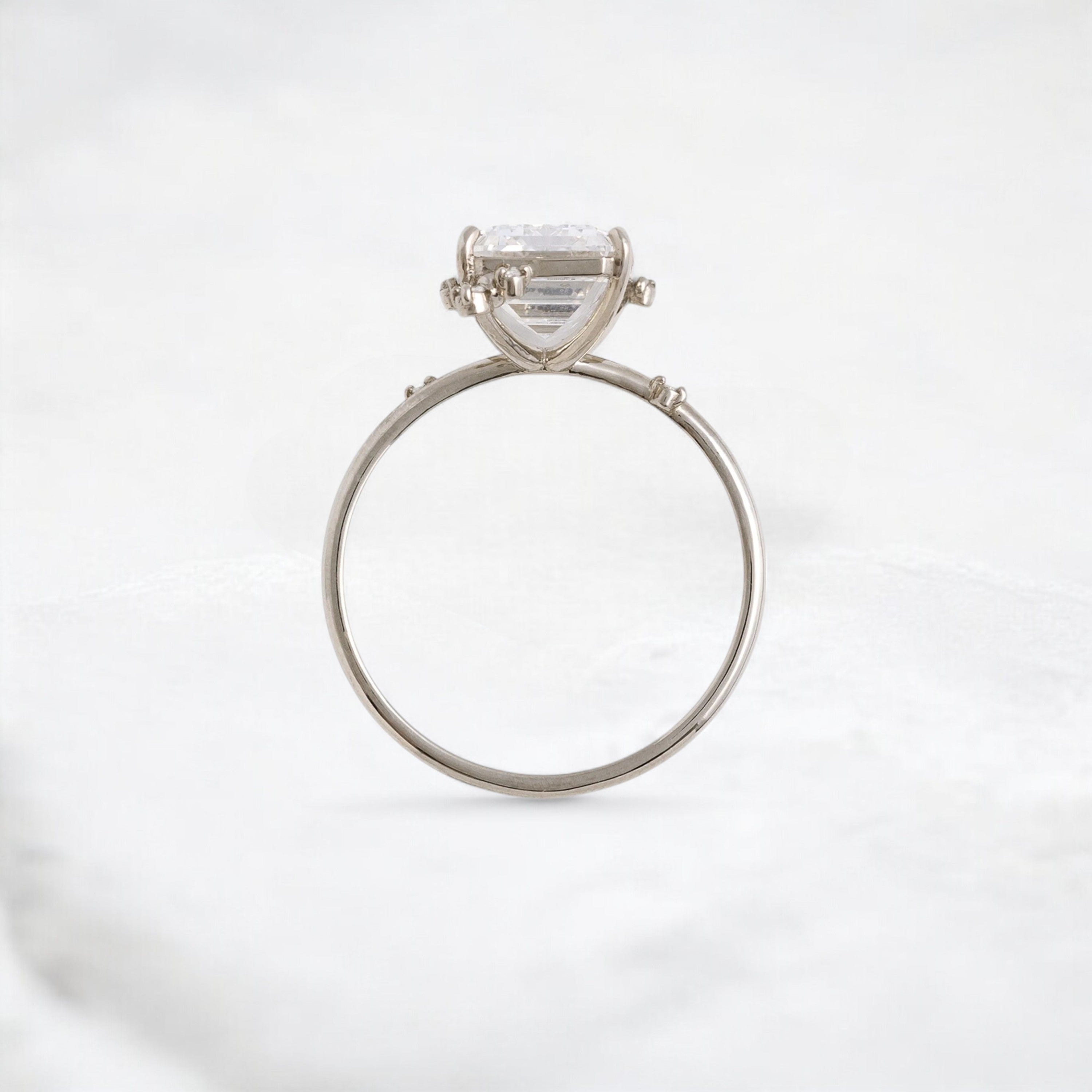 white-flameleaf-petals-emerald-moissanite-engagement-ring-4-25-ct-white-gold-gemfora-3
